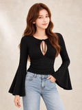Lace-Up Long Sleeve Top in Black, styled on model