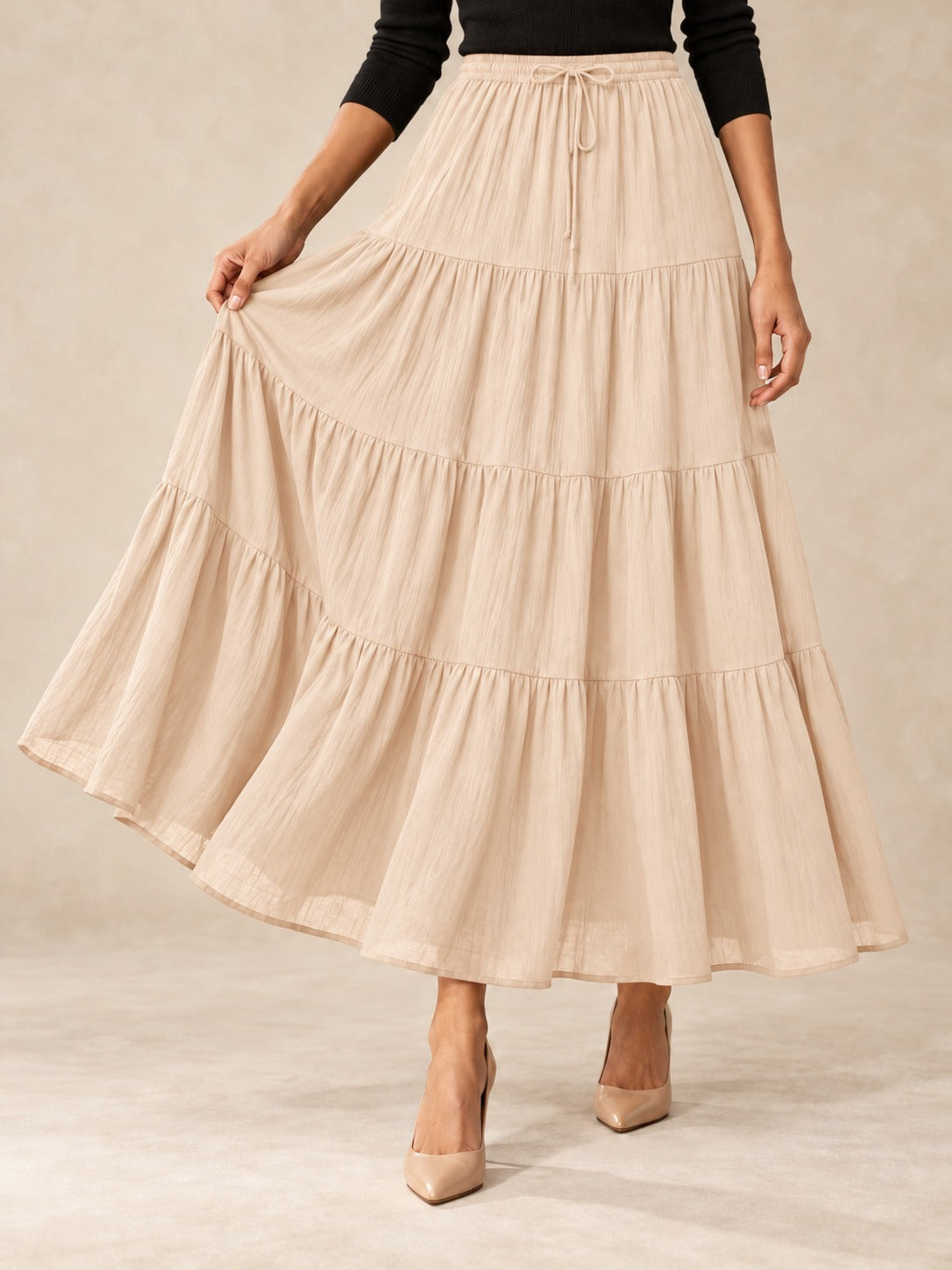 Tiered Cotton-Blend Maxi Skirt in Beige, styled on model